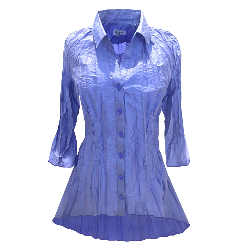 The blouse has a classic collar and 3/4 flair arms. It is cut in a tunic style with more length in the back. Lilac can be described as a subtle tone of violet with hues of blue, like dark periwinkle. The buttons are of the same color Lilac.